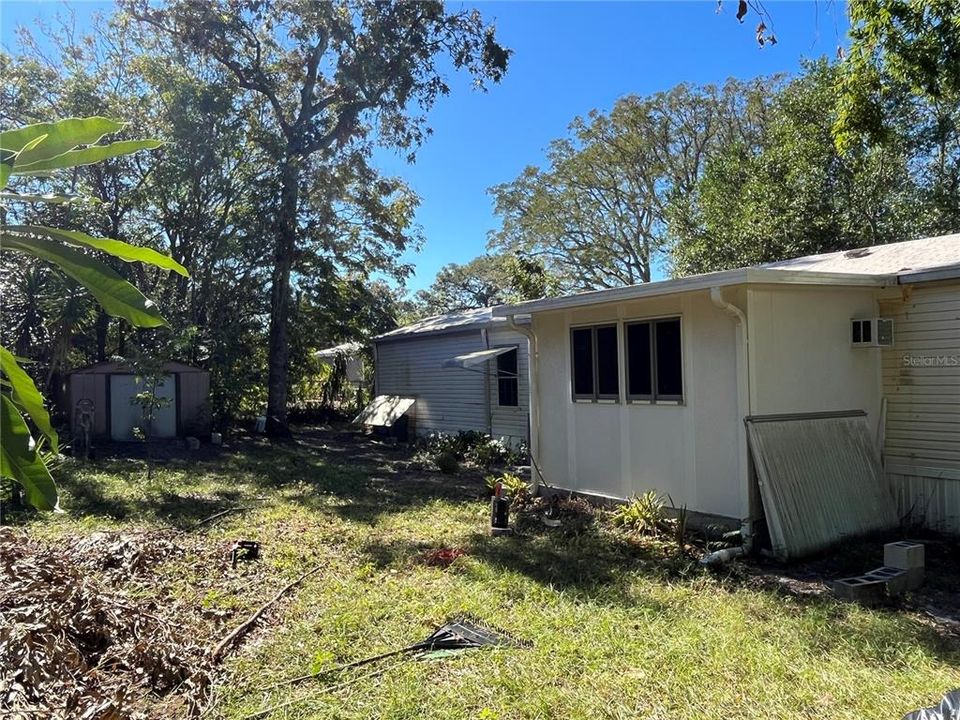 back yard with shed and barn