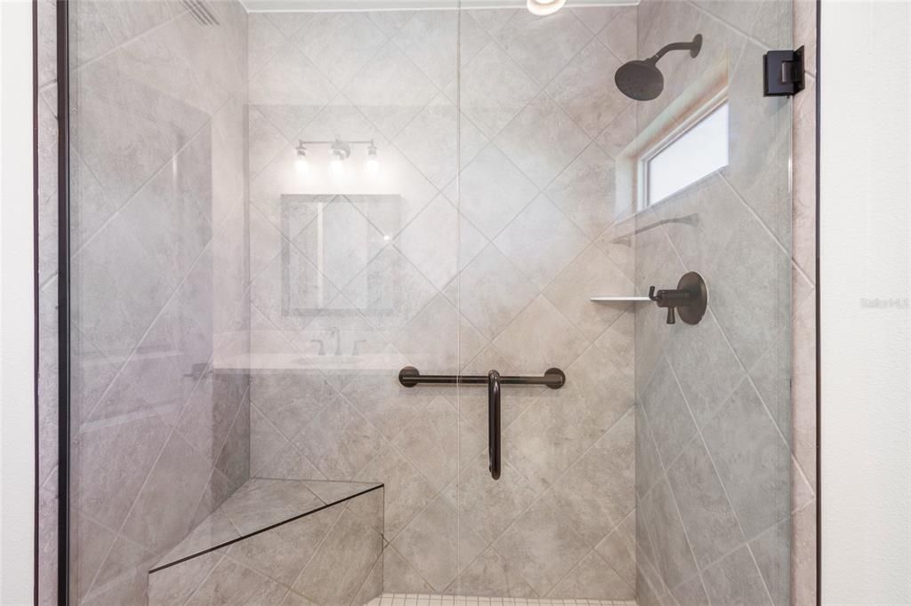 Large walk in shower with seating