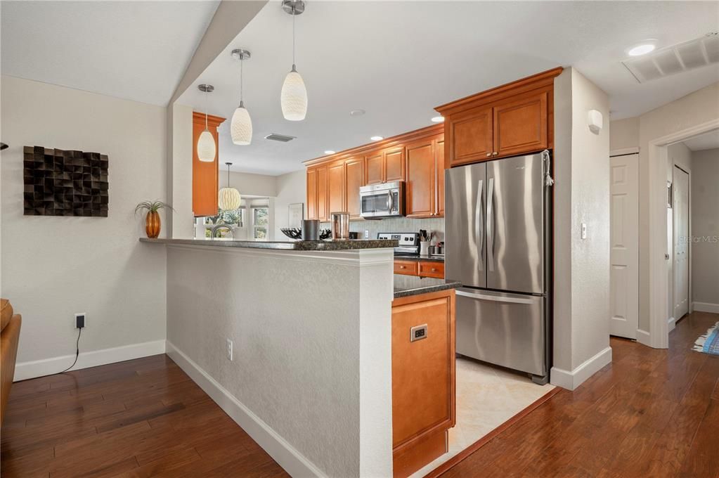 Kitchen upgrades include newer appliances, cabinets, granite counters