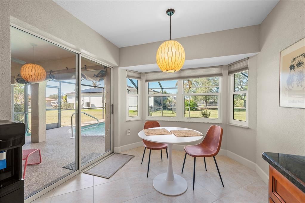 Breakfast nook has views of pool and greenbelt