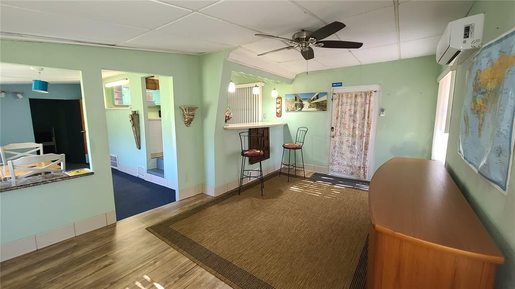 Living room with breakfast bar to kitchen.