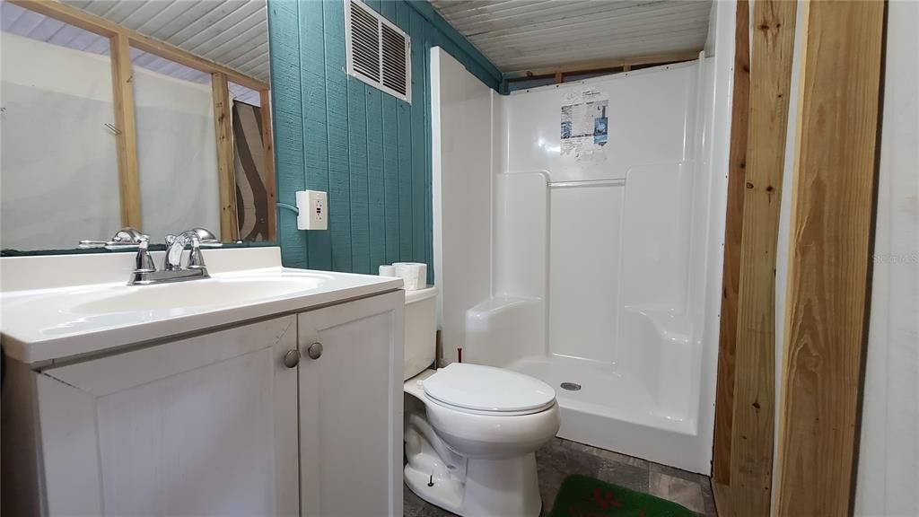 Full bath on the screened porch.