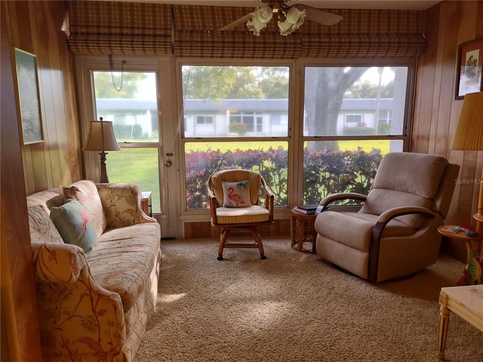 Bonus room, an extension of the living room, overlooks the back courtyard.