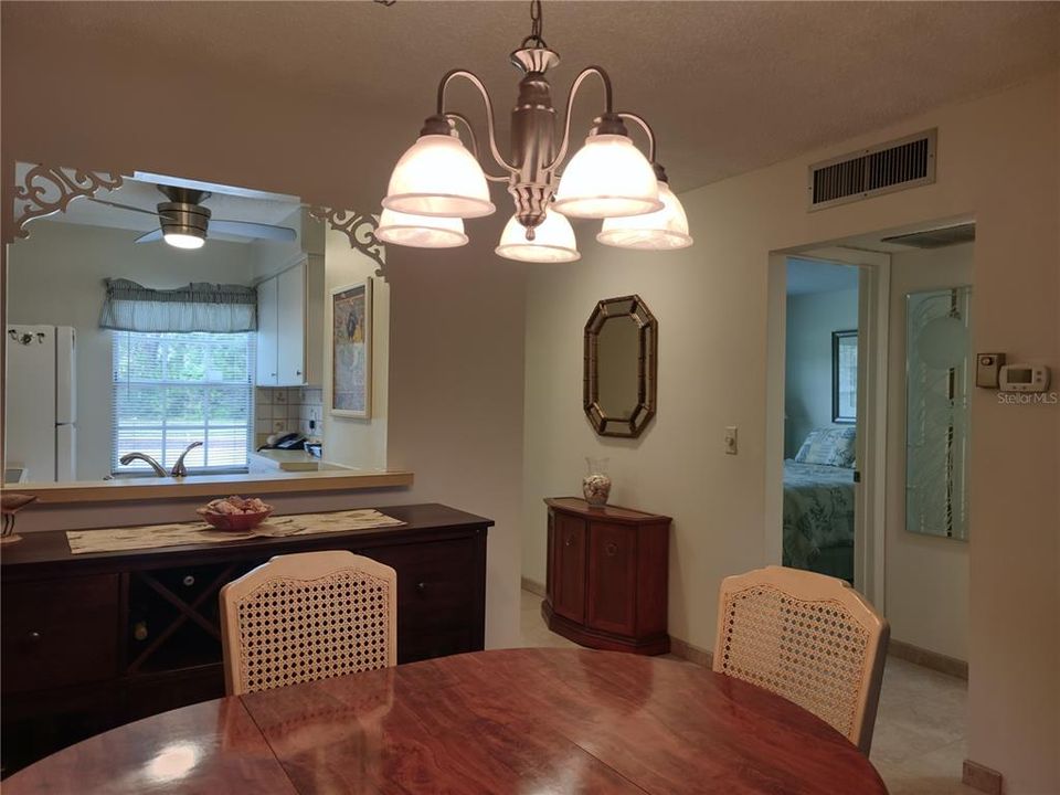 Floor plan layout of living area flow to kitchen, entry hallway and guest quarters.