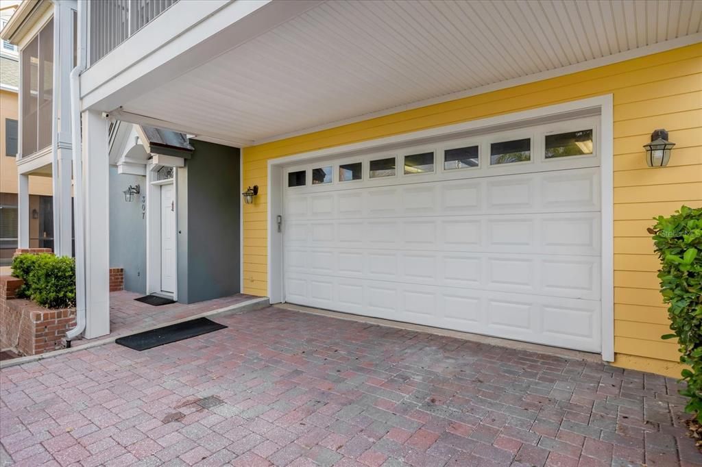 Rear view with garage and first floor apartment entrance