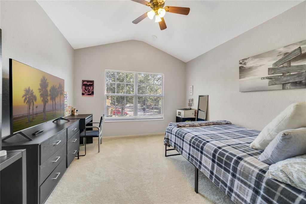 Large Bedroom with high ceilings.