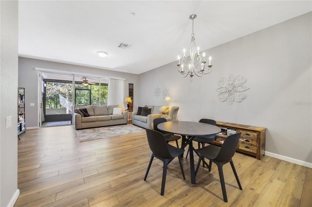 View of dining area in relation to living room and porch.