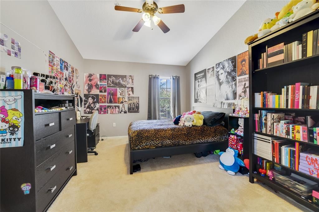 Bedroom 3 with high ceilings.