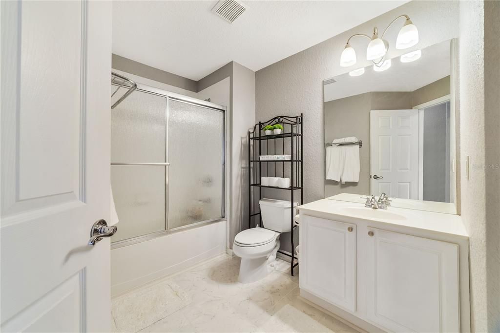 Second full bath with new tile floor.