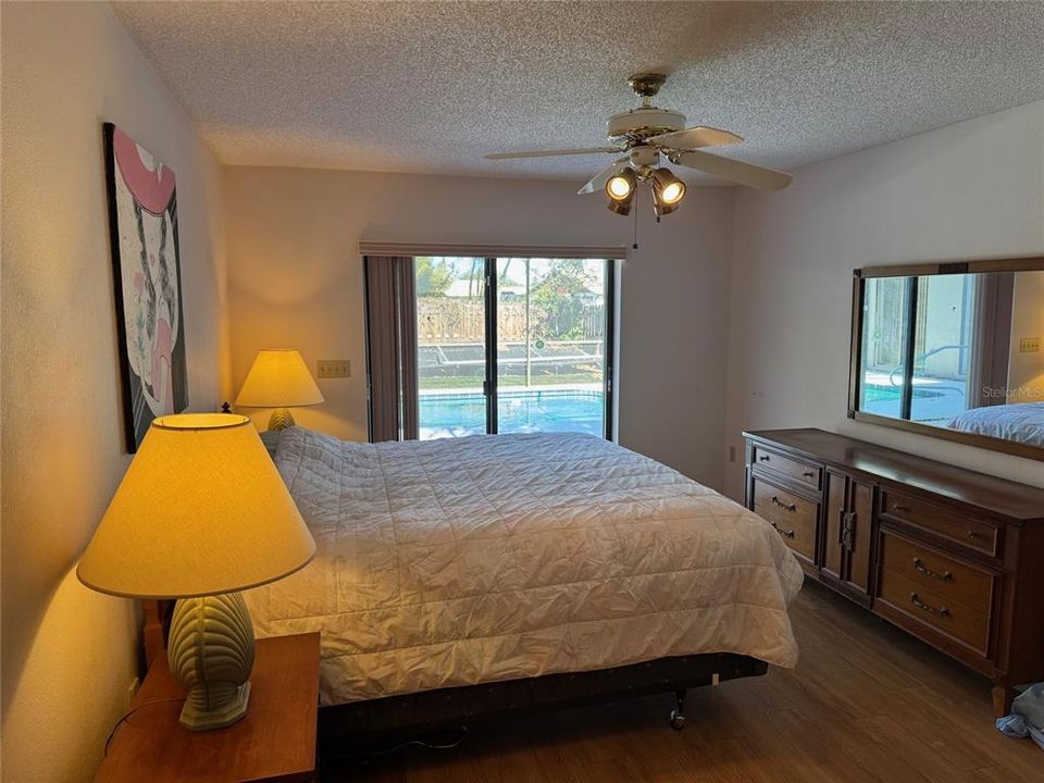 Primary Bedroom with Sliders to the Pool Area