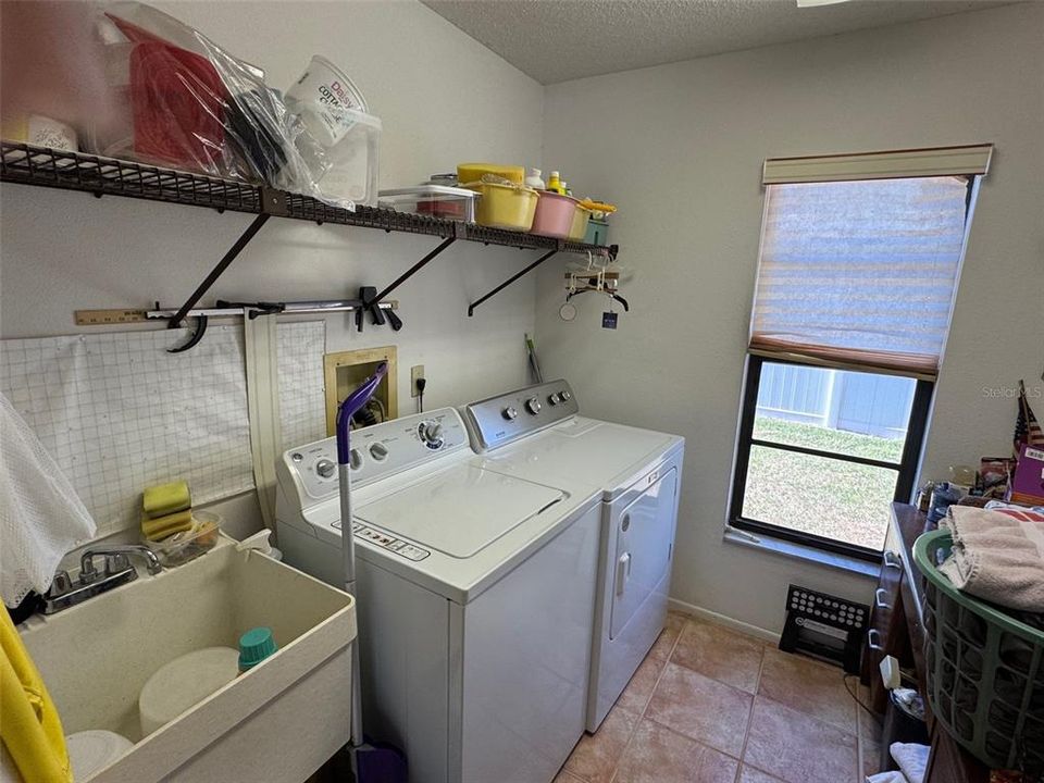 Inside Laundry Room with a Washer/Dryer & Laundry Sink