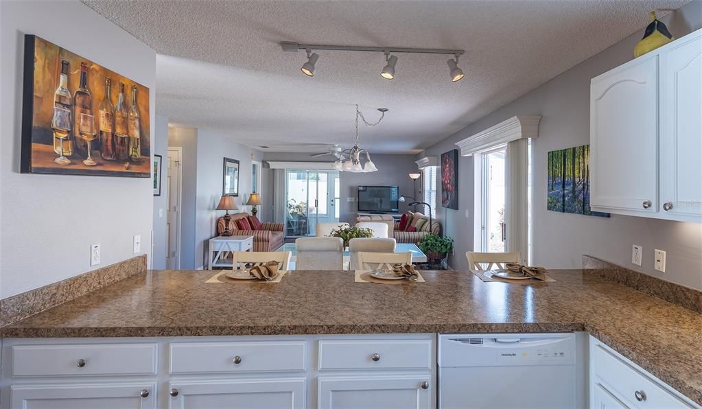 kitchen - breakfast bar - looking into living/dining rooms