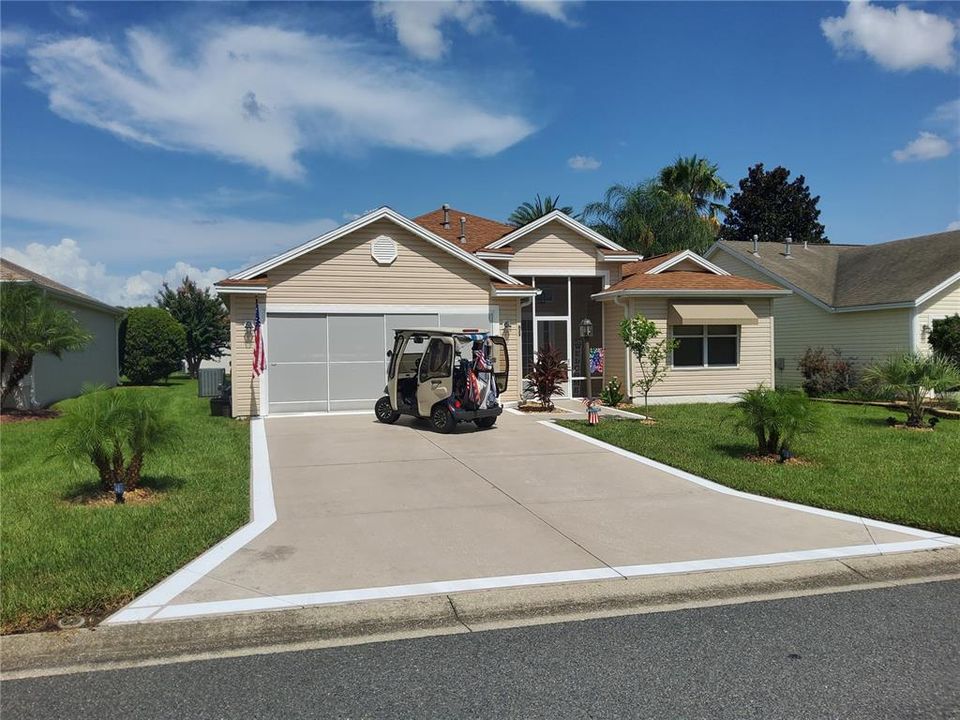 Front of house with Golf Cart