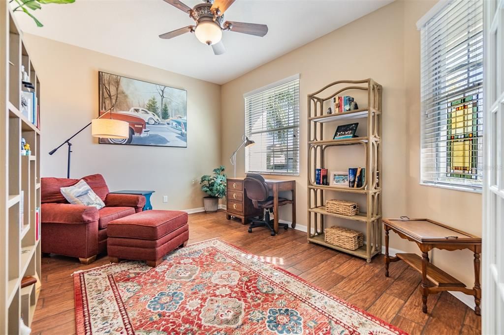 Double doors open to perfect space for a home office, den, music or reading room!