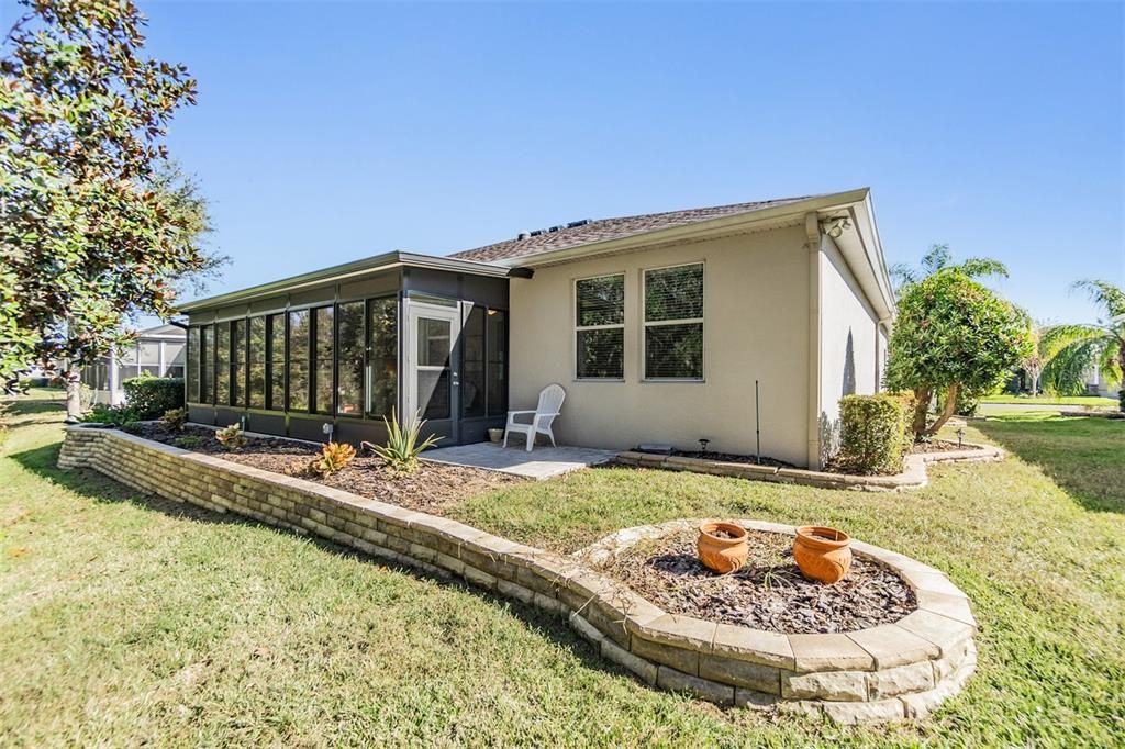 Rear view with Landscape beds, Brick paver accents and back patio to BBQ!