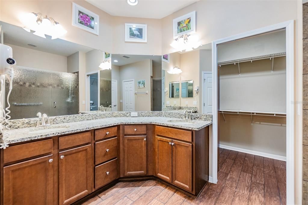 Dual sinks, large linen closet and plenty of storage in this bath ensuite