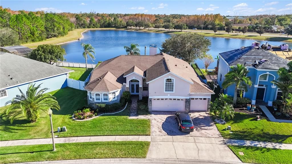 beautiful property with 3 car garage, bay window and brick pavers