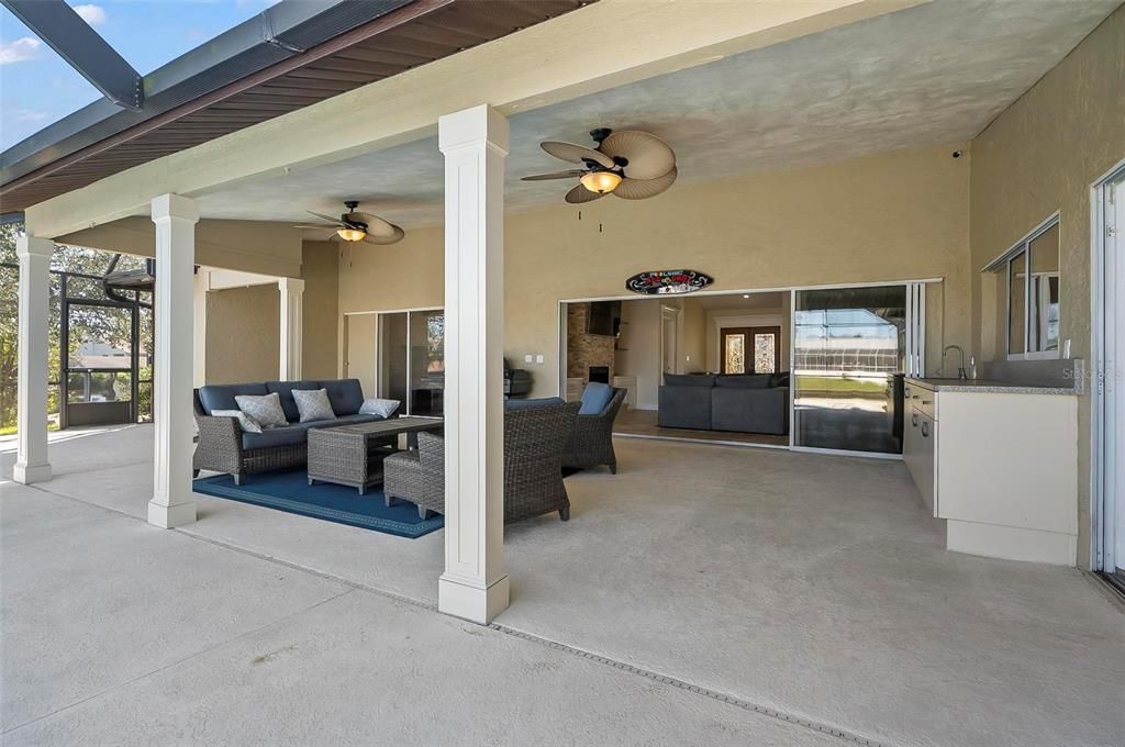 Massive covered lanai under truss that offers shade by late morning hours!