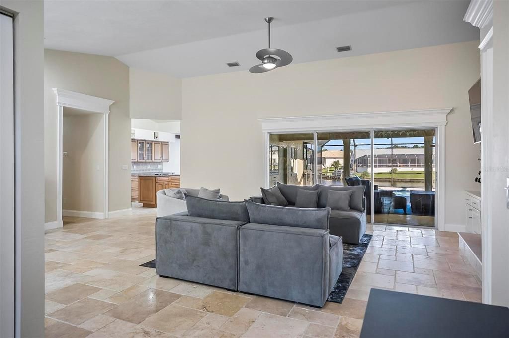 High vaulted ceilings and gorgeous custom travertine flooring!