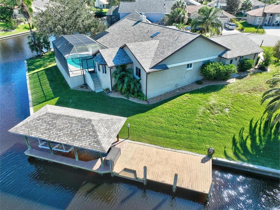 Covered boat lift and attached dock