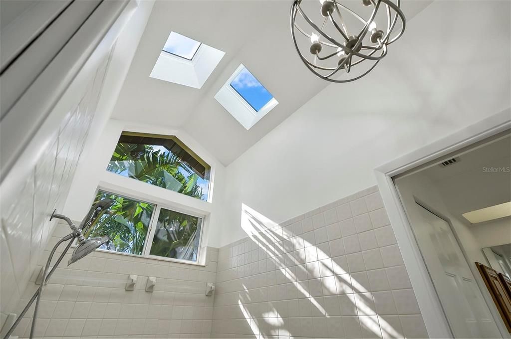 Large garden style ensuite shower with generous natural lighting but still a ton of privacy!