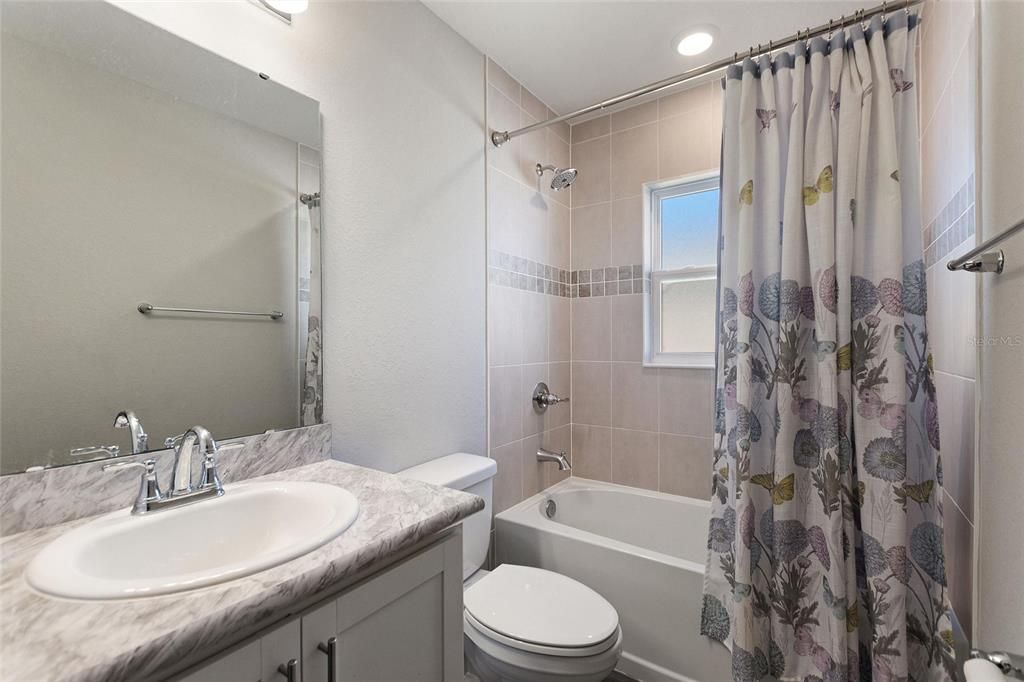 Guest bathroom located between bedrooms 3 & 4