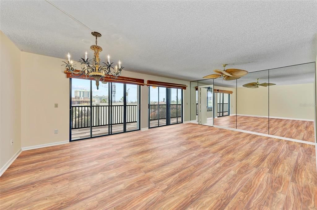 Dining/Living room. Primary bedroom through the door to the right.