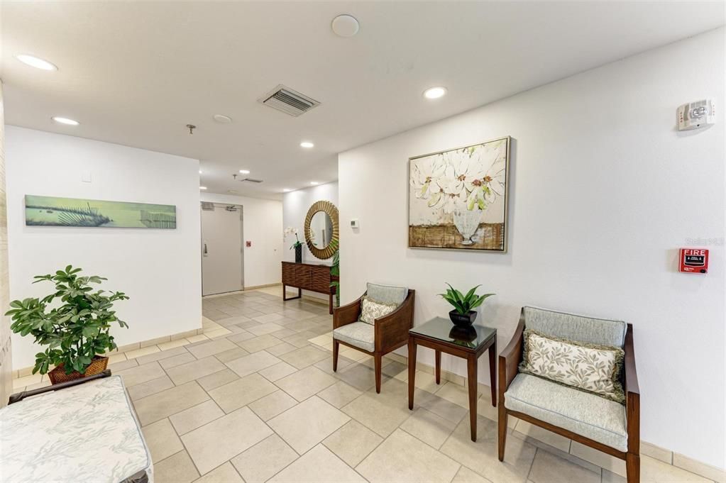 Common area before the elevator. Mailboxes are behind a wall to the left.