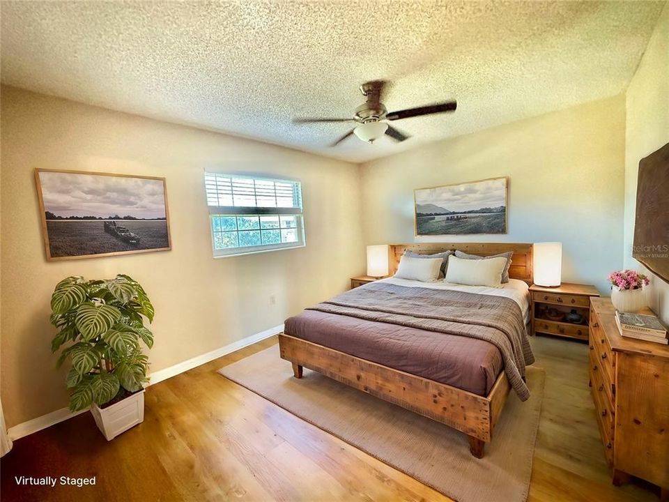 Primary bedroom offers warmth and privacy, with abundant natural light and cozy vibes.