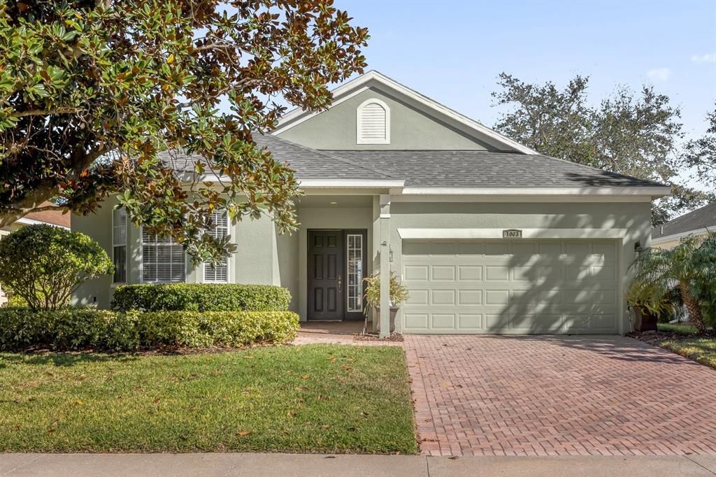 FRONT VIEW OF HOME WITH PAVER DRIVEWAY