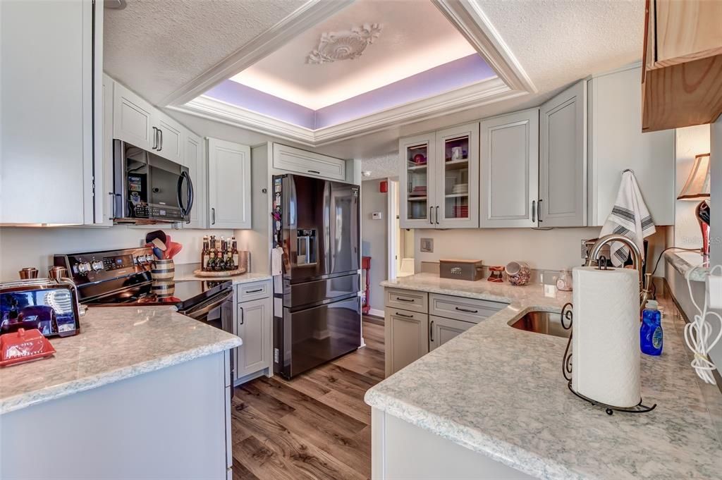 Kitchen with Quartz counters and black stainless appliances