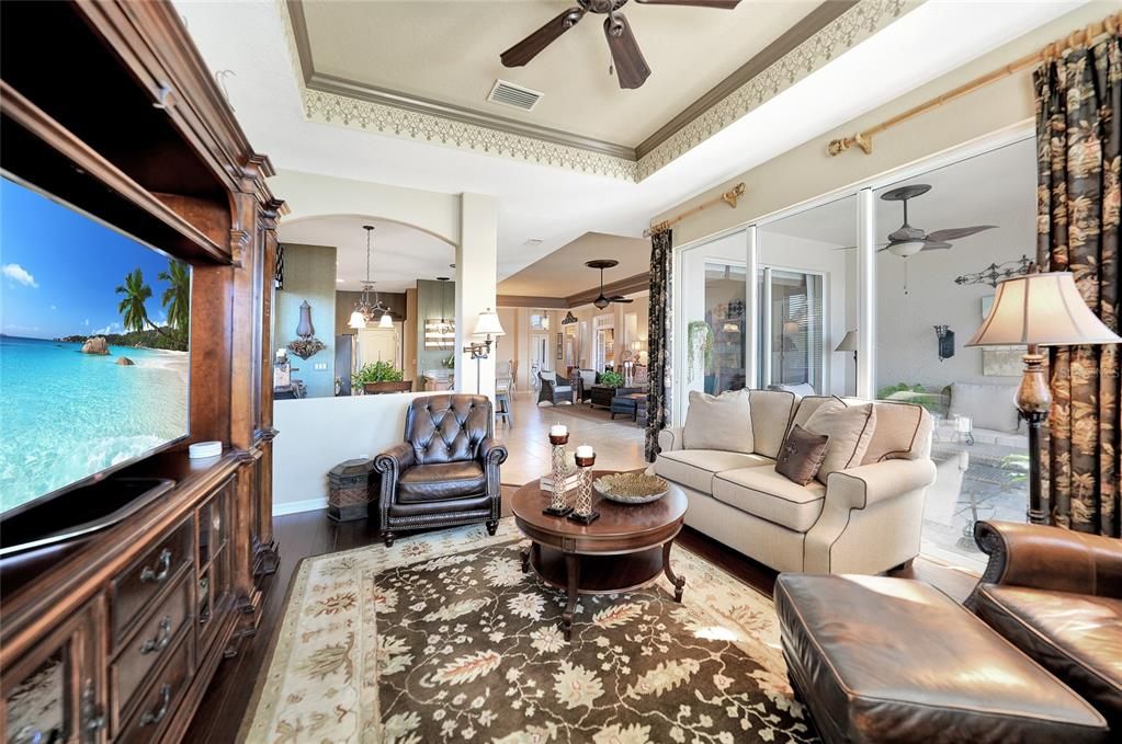 Looking from family room back out to living room. Also pictured here the covered lanai and both sets of slider doors