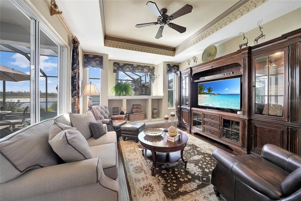 beautiful family room with sliding doors and so much natural light (TV hookups are also located under window in middle cut-out for a different furniture arrangement )