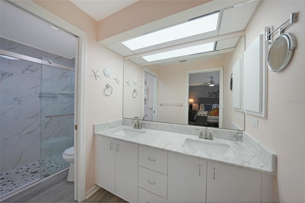 Primary bath with dual sinks and amazing walk in shower