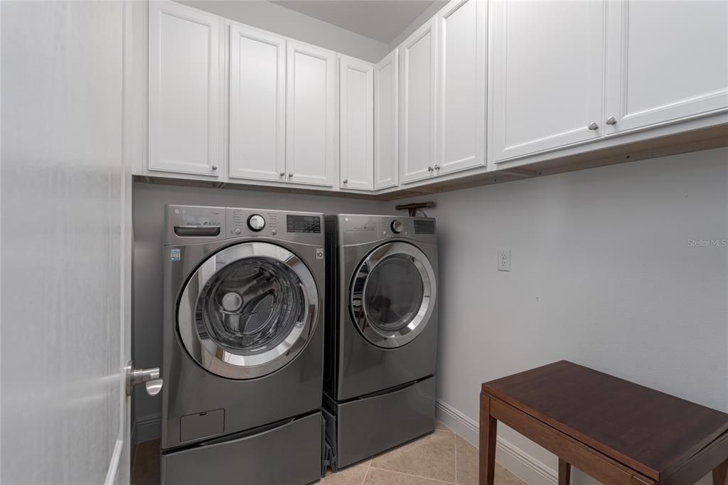 Laundry room- lots of extra cabinets for storage