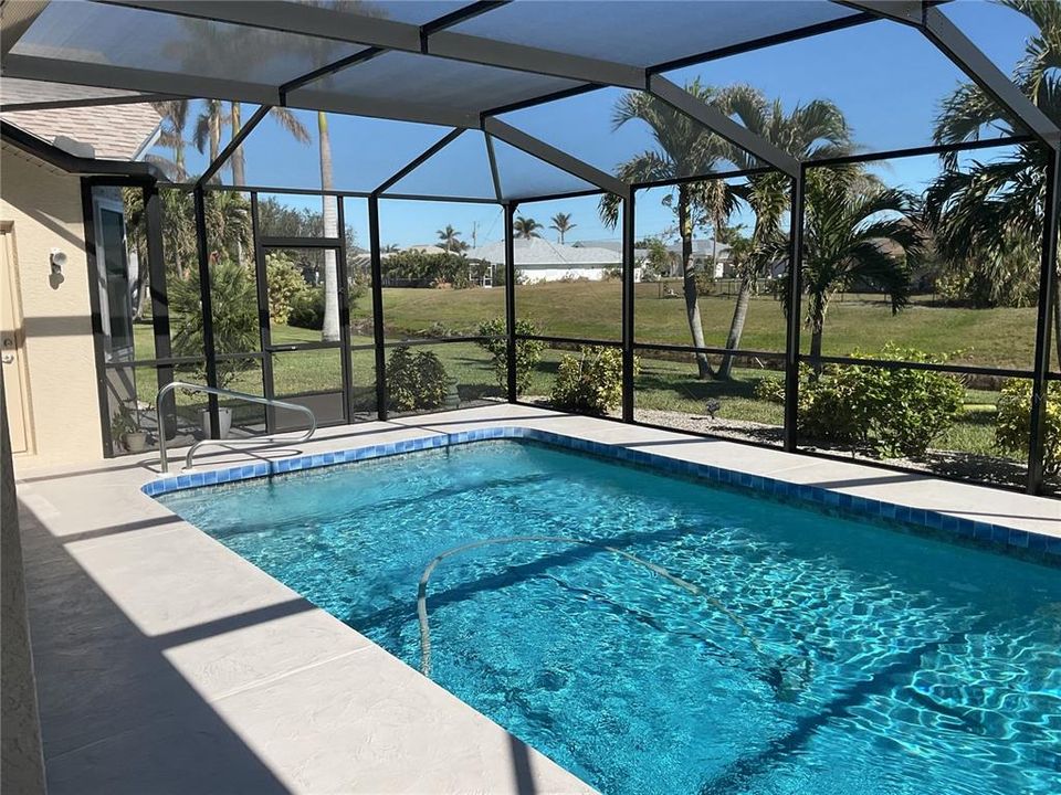 Lanai/pool overlooking canal