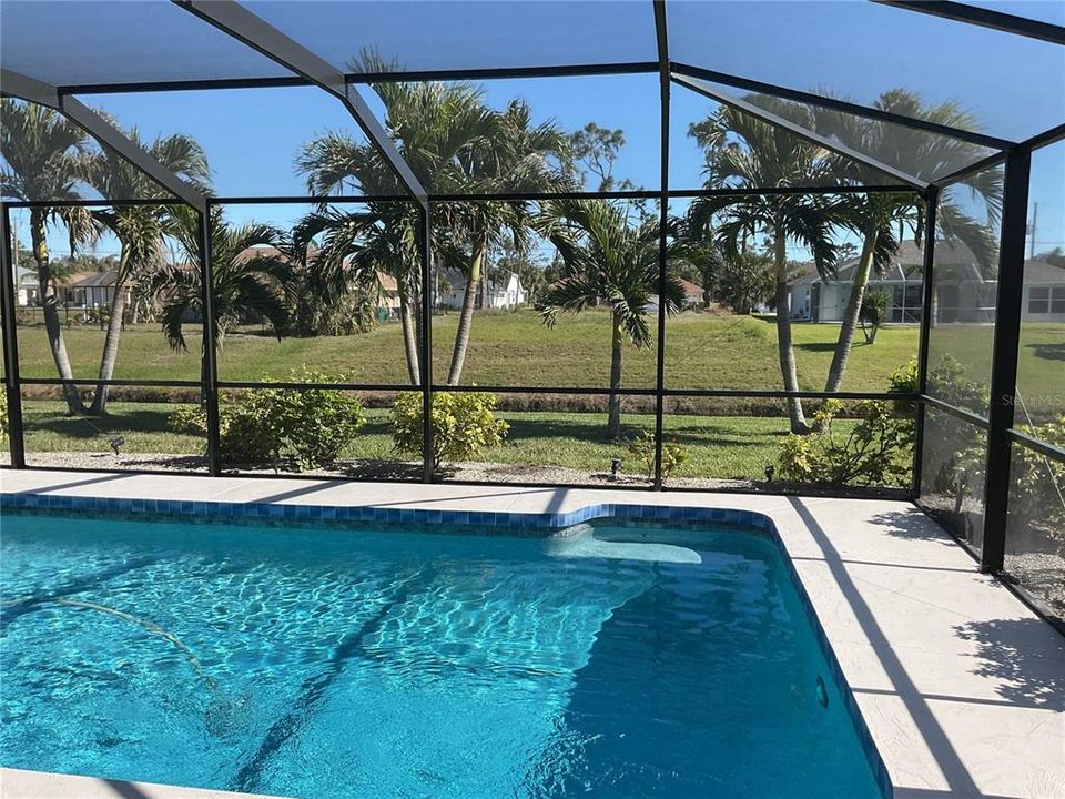 Lanai/pool overlooking canal