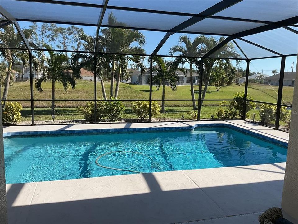 Lanai/pool overlooking canal