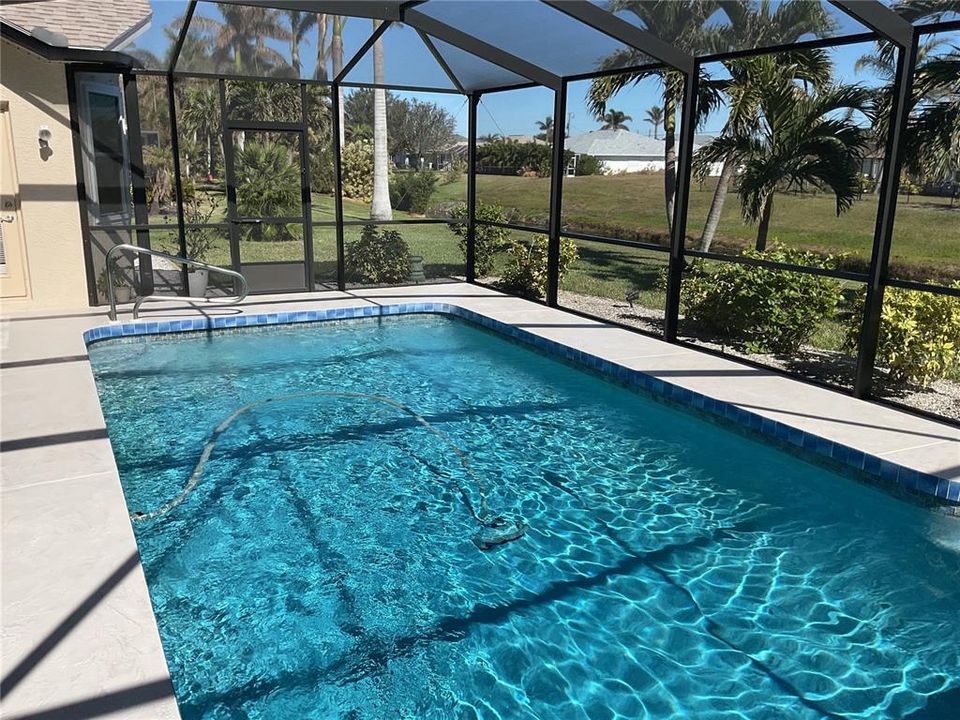 Lanai/pool overlooking canal