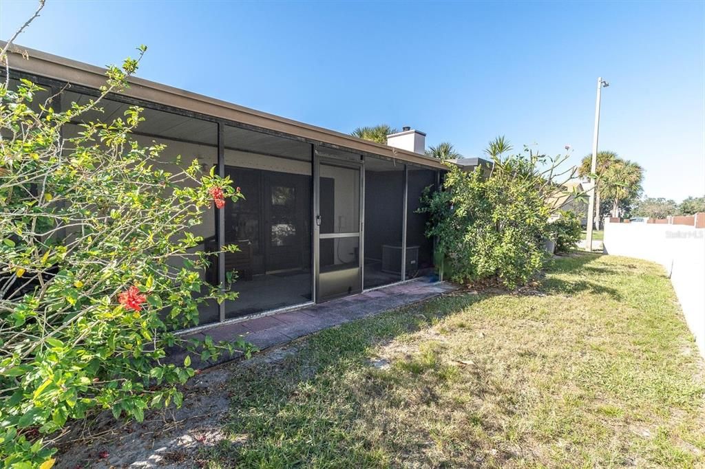 The back porch looks out at your own little back yard with a privacy wall that edges the outside of the community