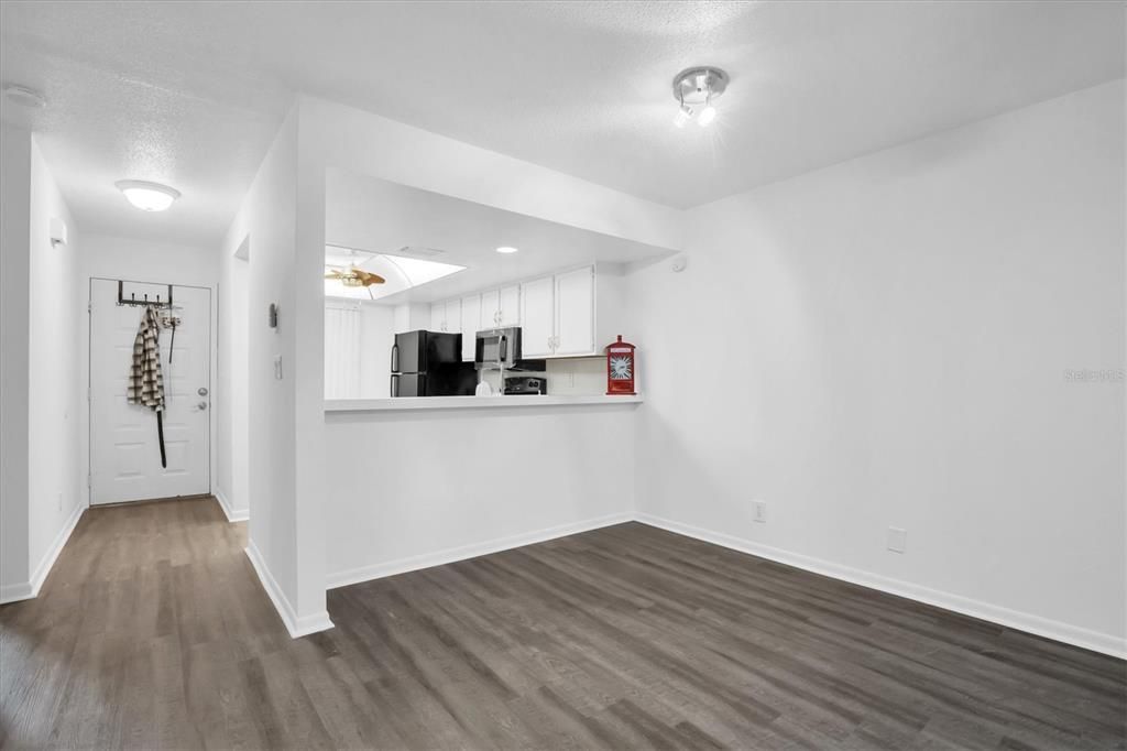 Here's a look at entry in to villa- That's your front door - on your left when entering is the kitchen, opens out to living and dining area. There's counter space for stools for eating at the bar.