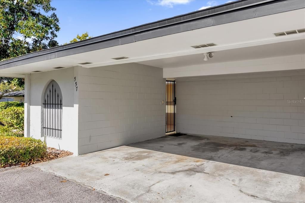 Carport With Iron Gate Entry into Courtyard