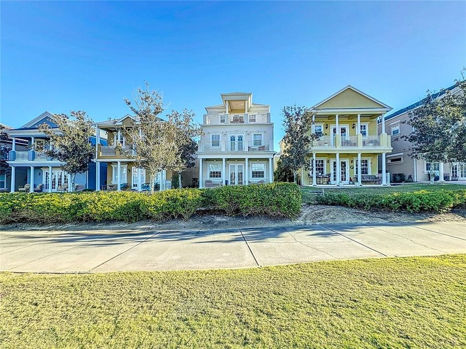 The home is a stunning architectural masterpiece that features an abundance of windows, French doors, and expansive balconies, allowing for a seamless connection between the indoors and outdoors across its three levels.