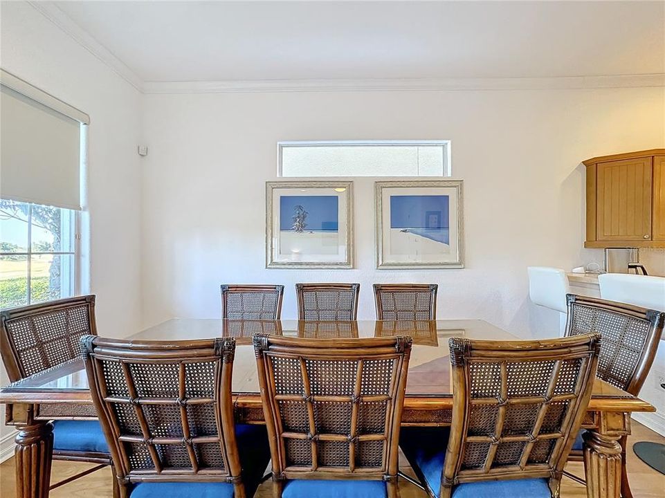 Another view of the dining room providing natural light flowing in from the gorgeous golf course view.