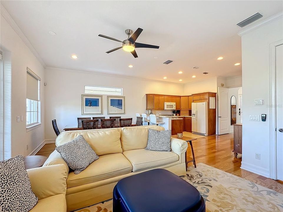 In the living room, the view to the outside is the star of the show.  The French doors open onto a patio that overlooks the lush green fairways.