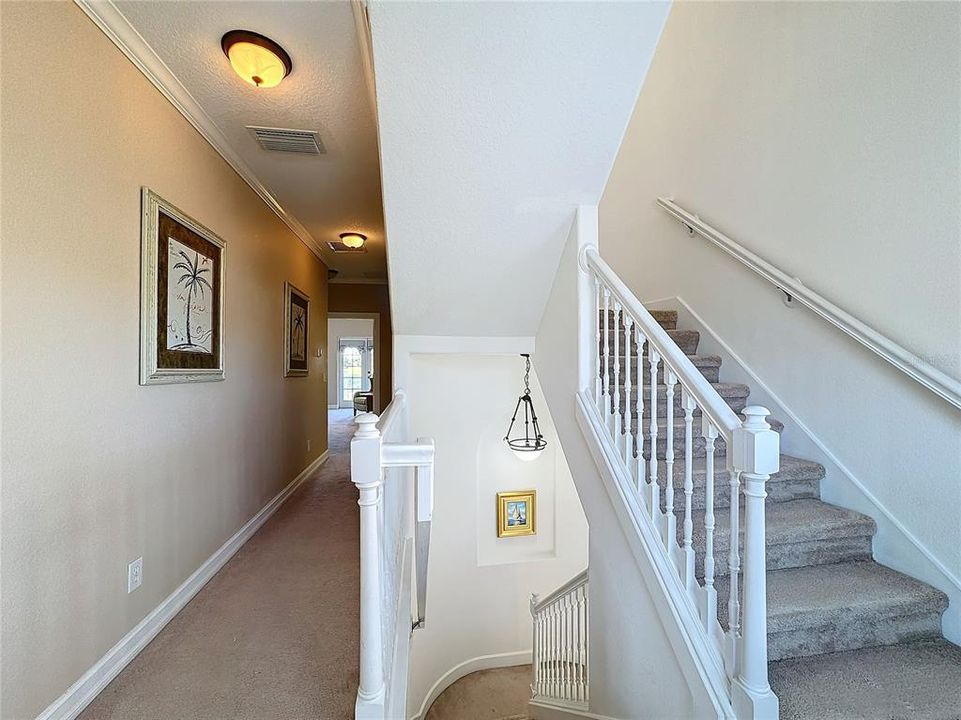 The staircase will take you up to two bedrooms on the second floor and one bedroom on the third floor.