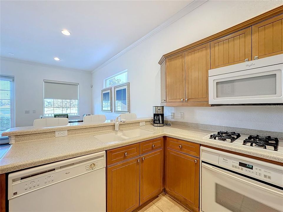 The breakfast bar serves as a casual eating space or a place for socializing with the chef.