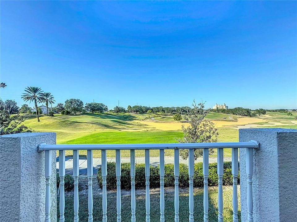 From the balcony, the view stretches across the well-kept grounds, where golfers can be seen teeing off or putting, framed by the trees and rolling greens. The greenery of the golf course creates a serene and tranquil atmosphere. The quiet, open space is perfect for enjoying the sights and sounds of nature, whether it’s the rustling of leaves in the breeze or the occasional sound of a golf ball striking the club.