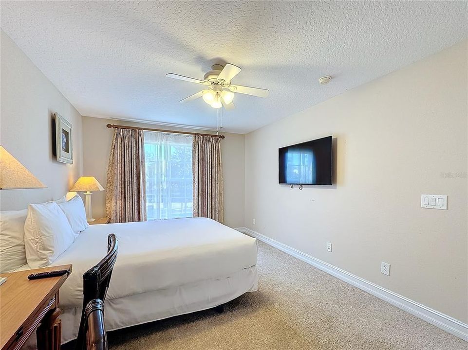 This bedroom also looks out toward the front of the home.