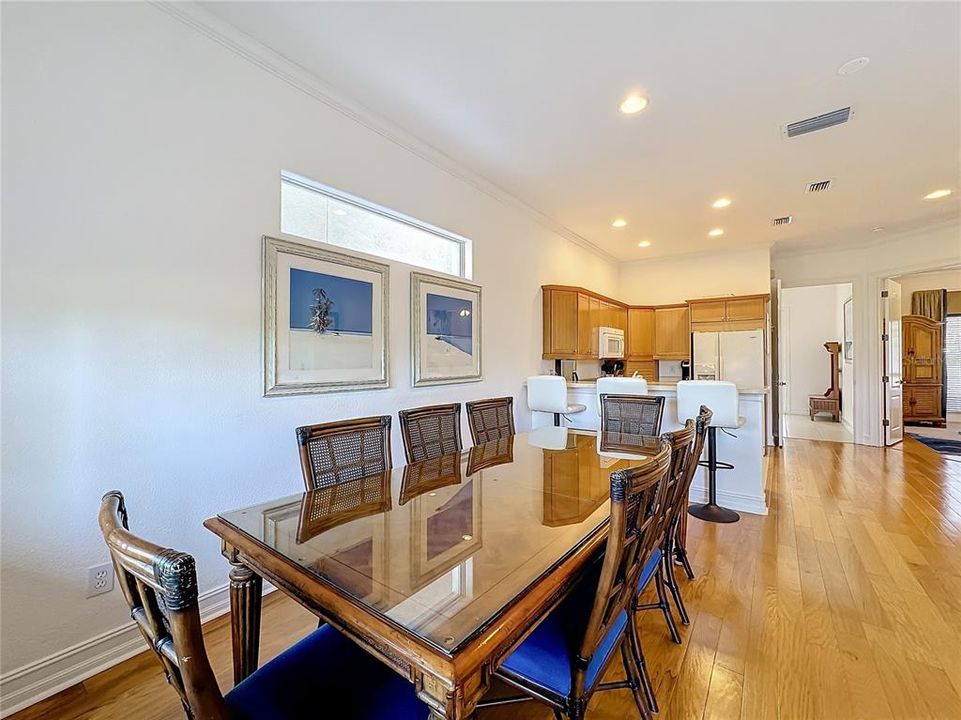 Adjacent to the kitchen, the dining room is defined by a large table that comfortable seats family and guests.